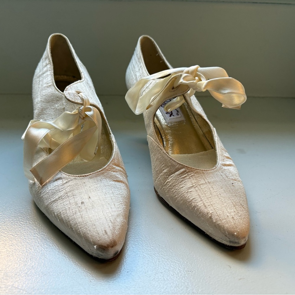 Fairytale crème silk dupioni Cinderella shoes with silk bow ties and heels.